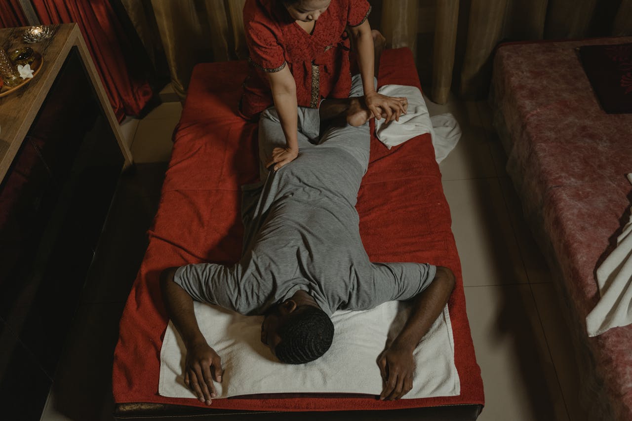 Relaxing Thai massage in a serene spa setting, enhancing wellness and relaxation.